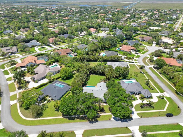 birds eye view of property with a residential view