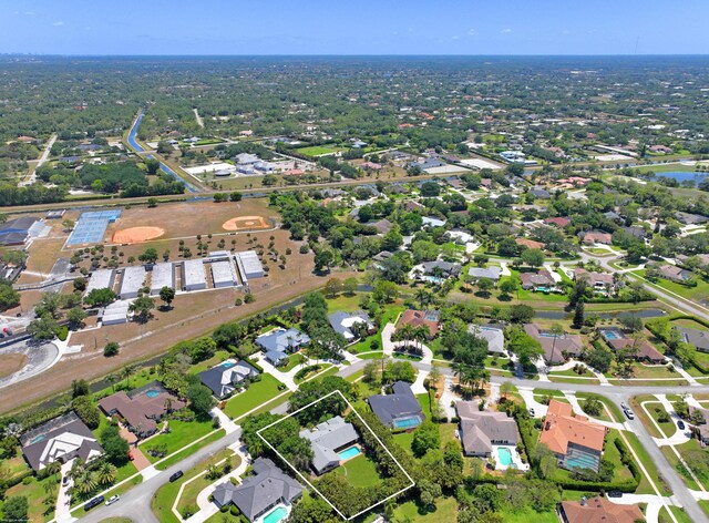 birds eye view of property featuring a residential view and a water view