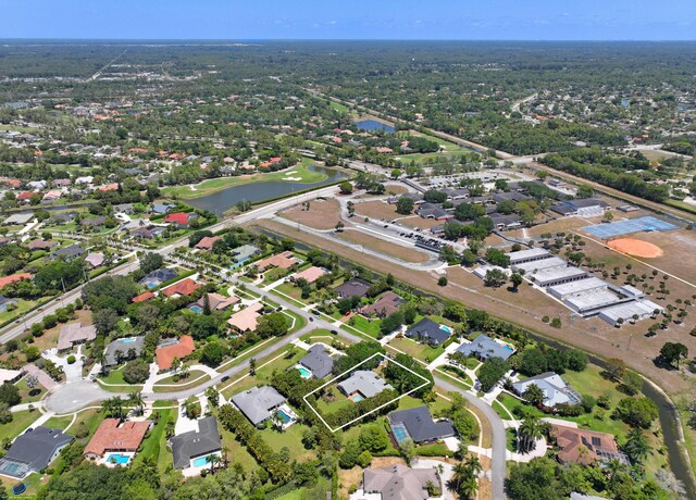 bird's eye view with a water view and a residential view