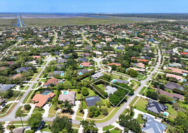 bird's eye view featuring a water view and a residential view