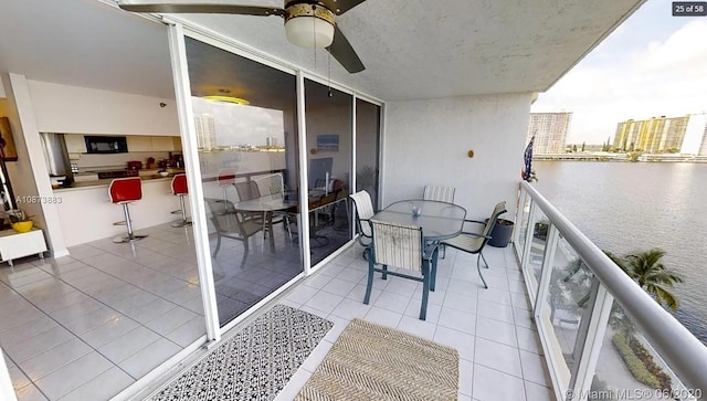 17700 N Bay Rd Unit 702, Sunny Isles Beach, FL 33160 - balcony featuring a ceiling fan and a water view