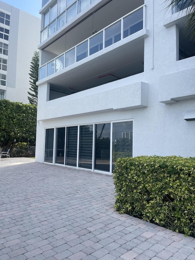17700 N Bay Rd Unit 702, Sunny Isles Beach, FL 33160 - back of house featuring stucco siding