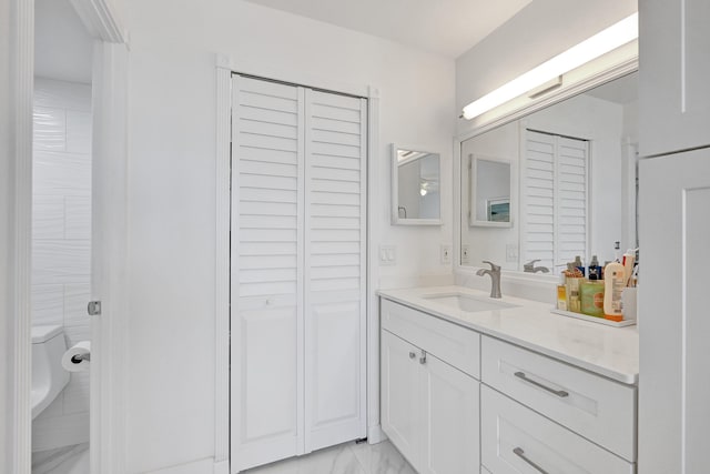 6 Royal Palm Way Unit 506, Boca Raton, FL 33432 - bathroom featuring vanity, a closet, toilet, and marble finish floor