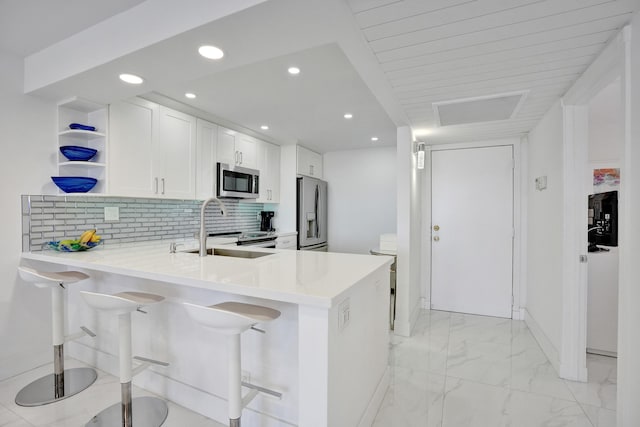 6 Royal Palm Way Unit 506, Boca Raton, FL 33432 - kitchen featuring white cabinets, open shelves, appliances with stainless steel finishes, a sink, and light countertops