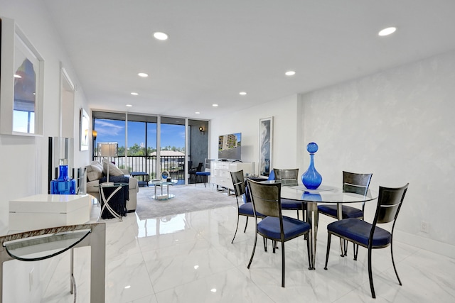 6 Royal Palm Way Unit 506, Boca Raton, FL 33432 - dining area featuring recessed lighting, a wall of windows, and marble finish floor