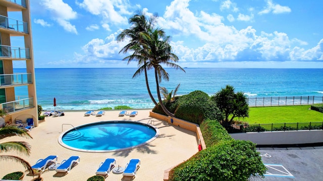 5440 N Ocean Dr Unit 202, Singer Island, FL 33404 - pool featuring a water view, fence, and a patio