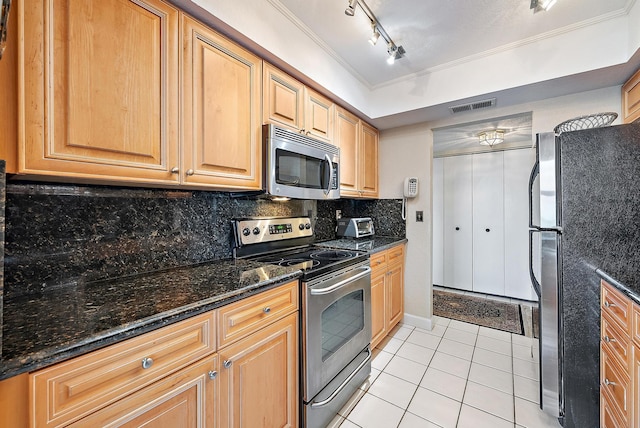 5440 N Ocean Dr Unit 202, Singer Island, FL 33404 - kitchen with visible vents, track lighting, light tile patterned flooring, tasteful backsplash, and appliances with stainless steel finishes