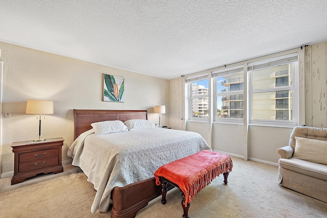 5440 N Ocean Dr Unit 202, Singer Island, FL 33404 - bedroom featuring baseboards, a textured ceiling, and carpet
