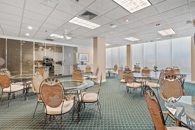 5440 N Ocean Dr Unit 202, Singer Island, FL 33404 - dining space with ceiling fan, carpet flooring, and visible vents