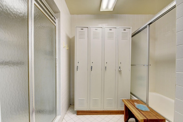 5440 N Ocean Dr Unit 202, Singer Island, FL 33404 - full bath featuring tile patterned flooring, a shower with shower door, and a closet