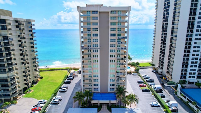 5440 N Ocean Dr Unit 202, Singer Island, FL 33404 - exterior space with a water view, uncovered parking, and a view of the beach