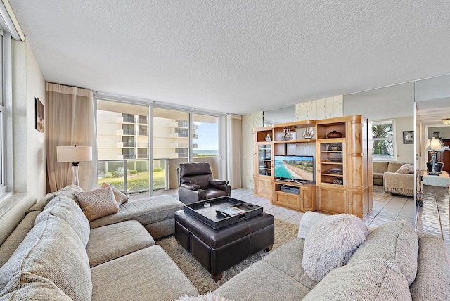 5440 N Ocean Dr Unit 202, Singer Island, FL 33404 - living area with a textured ceiling and light tile patterned floors