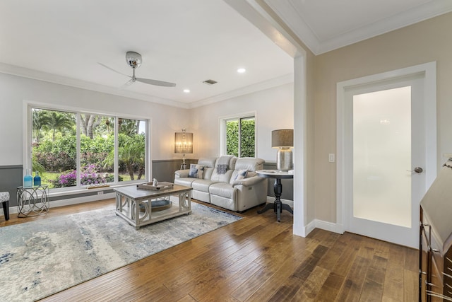 living room with a ceiling fan, visible vents, ornamental molding, recessed lighting, and hardwood / wood-style floors