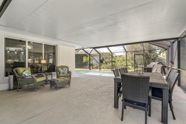 view of patio / terrace with glass enclosure and an outdoor pool