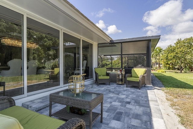 view of patio with outdoor lounge area and a sunroom