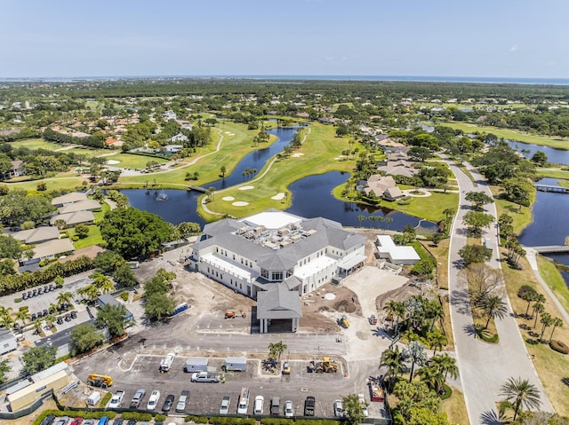 aerial view featuring a water view and view of golf course