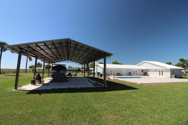 7175 NW 82nd Ct, Okeechobee, FL 34972 - dock area with a yard and an outdoor pool