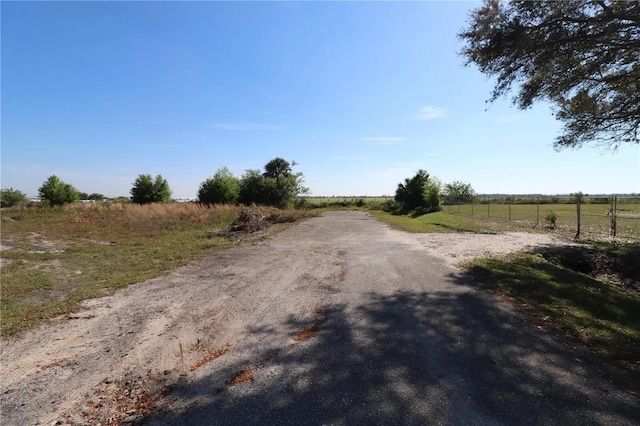 7175 NW 82nd Ct, Okeechobee, FL 34972 - view of street with a rural view