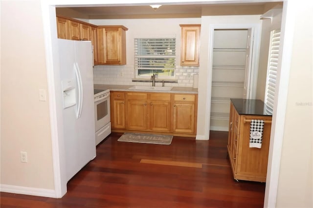 7175 NW 82nd Ct, Okeechobee, FL 34972 - kitchen featuring baseboards, white appliances, a sink, dark wood-type flooring, and tasteful backsplash