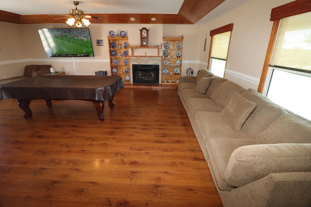7175 NW 82nd Ct, Okeechobee, FL 34972 - living room with billiards, plenty of natural light, and wood finished floors
