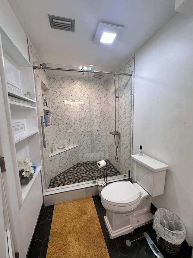 bathroom featuring a marble finish shower, tile patterned flooring, toilet, and visible vents