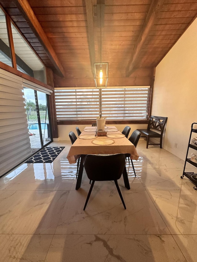 dining room with lofted ceiling with beams, wooden ceiling, and marble finish floor