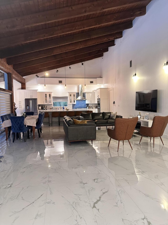living room featuring marble finish floor, beam ceiling, high vaulted ceiling, and wooden ceiling