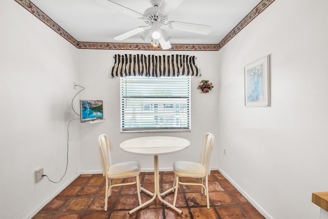 36 Stratford Ln Unit F, Boynton Beach, FL 33436 - dining room featuring ceiling fan and baseboards
