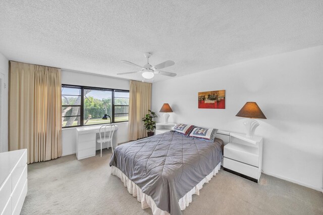 36 Stratford Ln Unit F, Boynton Beach, FL 33436 - bedroom featuring carpet flooring, a textured ceiling, and a ceiling fan