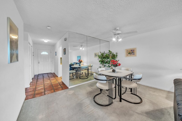 36 Stratford Ln Unit F, Boynton Beach, FL 33436 - carpeted dining space with ceiling fan, a textured ceiling, and baseboards
