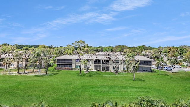 36 Stratford Ln Unit F, Boynton Beach, FL 33436 - back of property with a yard