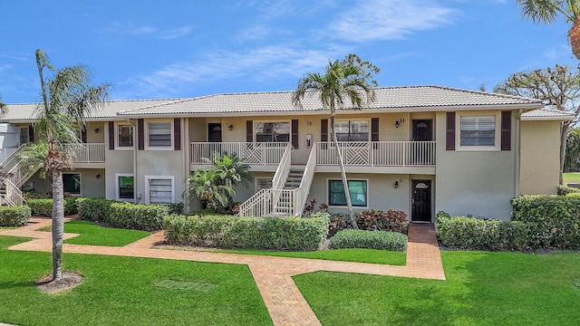 36 Stratford Ln Unit F, Boynton Beach, FL 33436 - view of property featuring stairway