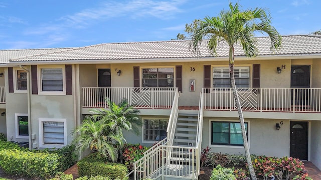 36 Stratford Ln Unit F, Boynton Beach, FL 33436 - view of building exterior featuring stairs