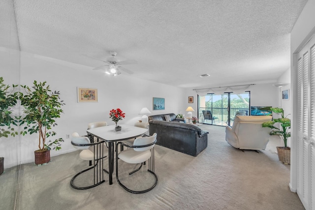 36 Stratford Ln Unit F, Boynton Beach, FL 33436 - carpeted dining space with a textured ceiling and a ceiling fan
