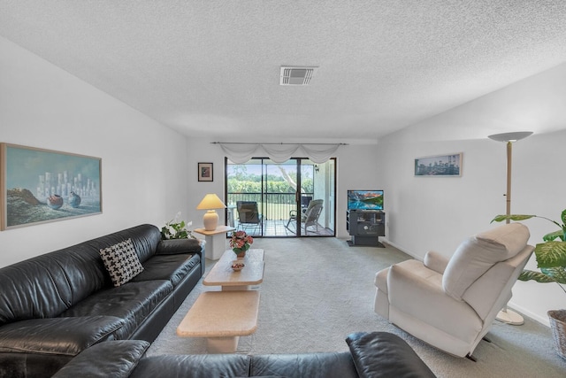 36 Stratford Ln Unit F, Boynton Beach, FL 33436 - carpeted living room featuring a textured ceiling