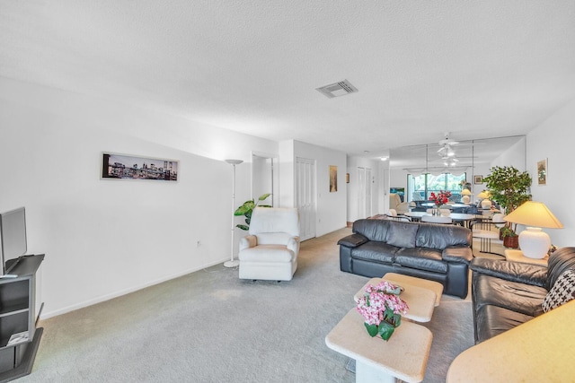 36 Stratford Ln Unit F, Boynton Beach, FL 33436 - carpeted living room with a textured ceiling and baseboards