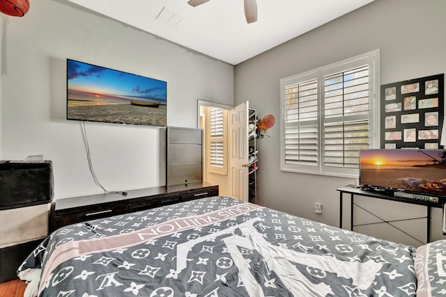 bedroom featuring ceiling fan and visible vents