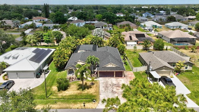 birds eye view of property with a residential view