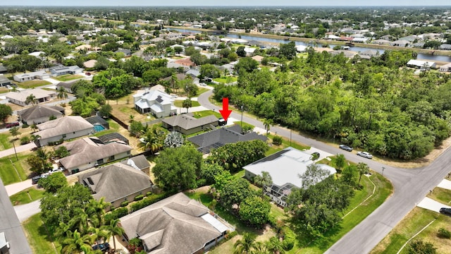 aerial view featuring a water view and a residential view