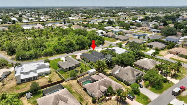 aerial view with a water view and a residential view