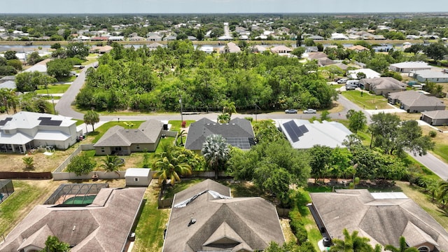 birds eye view of property with a residential view