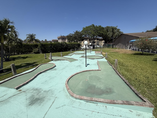 view of property's community with a yard