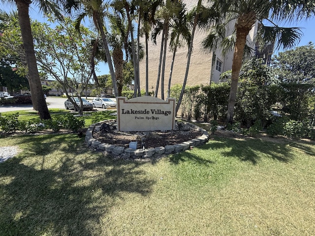 community / neighborhood sign with a lawn