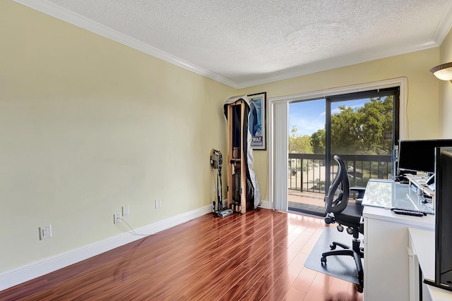 office space with crown molding, baseboards, a textured ceiling, and wood finished floors