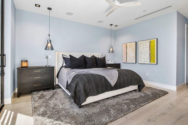 914 Palm Trl, Delray Beach, FL 33483 - bedroom featuring a ceiling fan, baseboards, and light wood-style floors