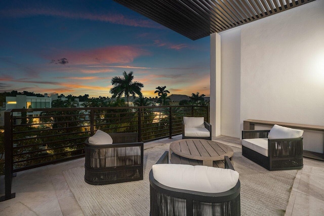 914 Palm Trl, Delray Beach, FL 33483 - patio terrace at dusk featuring a balcony