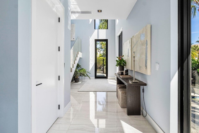 914 Palm Trl, Delray Beach, FL 33483 - entryway with stairs, baseboards, and marble finish floor