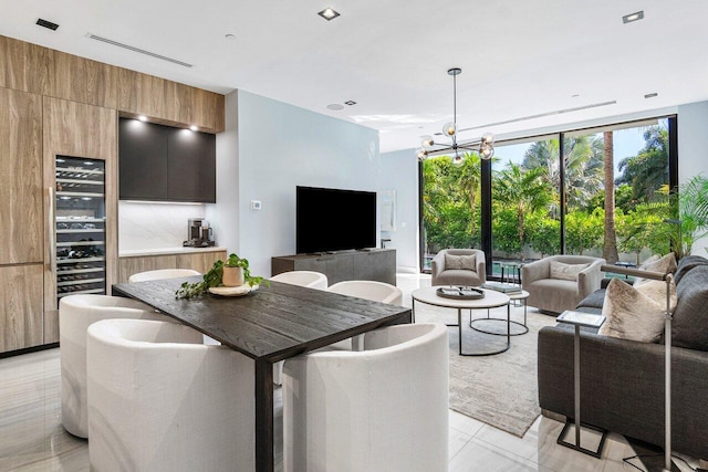 914 Palm Trl, Delray Beach, FL 33483 - dining area featuring an inviting chandelier, floor to ceiling windows, and beverage cooler