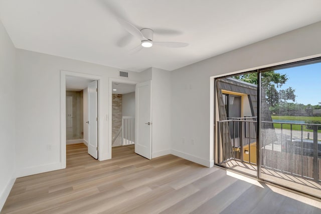 2003 20th Way, West Palm Beach, FL 33407 - unfurnished bedroom featuring light wood-style floors, access to outside, baseboards, and ceiling fan