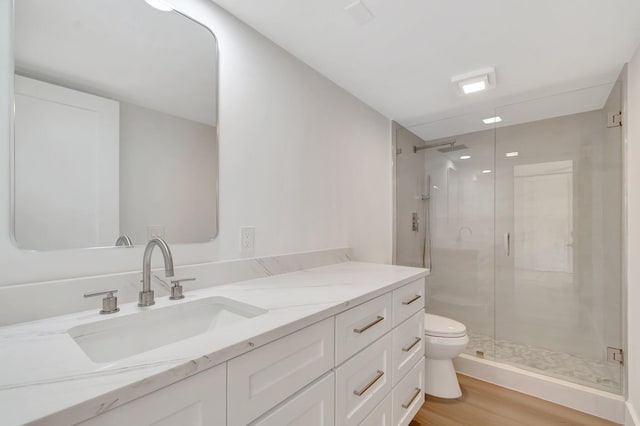 2003 20th Way, West Palm Beach, FL 33407 - full bath featuring wood finished floors, a stall shower, vanity, and toilet
